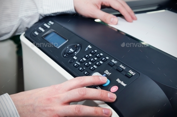 Man using scanner multifunction device in office (Misc) Photo Download