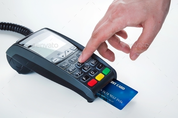 Hand with credit card swipe through terminal for sale (Misc) Photo Download