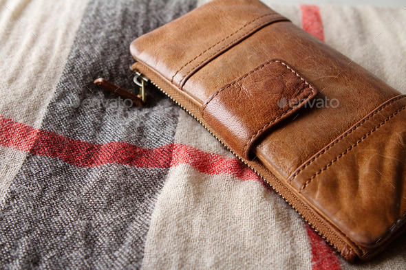 Brown fashion leather purse on a hessian fabric (Misc) Photo Download