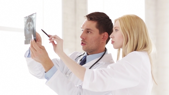 VideoHive Two Doctors Discussing X-ray Image At Hospital 11146986 VideoHive Two Doctors Discussing X-ray Image At Hospital 11146986