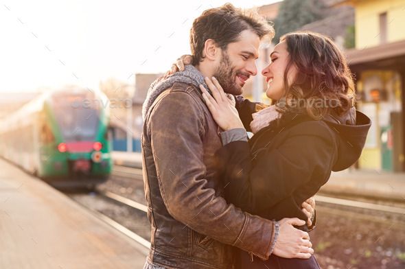 Loving couple at train station (Misc) Photo Download