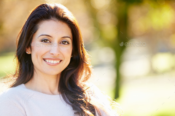 Portrait Of Attractive Hispanic Woman In Countryside