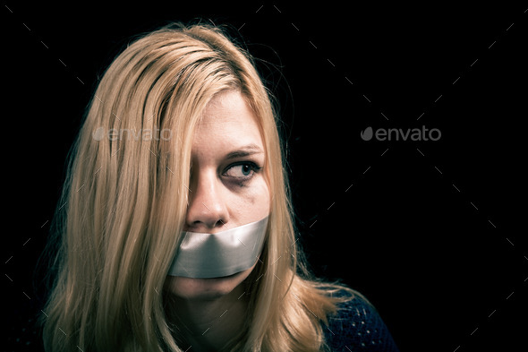 Kidnapped woman hostage with tape over her mouth
