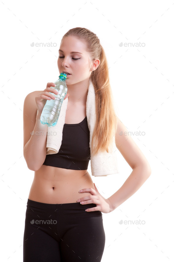 Young healthy girl with bottle of water in hands (Misc) Photo Download