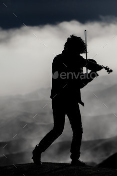 violinist silhouette on the volcano