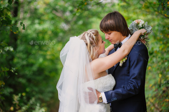 bride and groom for a walk in the park (Misc) Photo Download