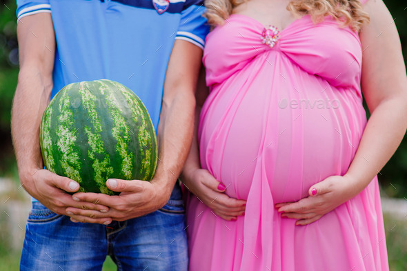 happy couple outdoor beautiful pregnant woman with her husband (Misc) Photo Download