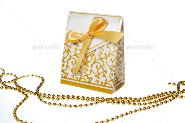 white box with festive ornaments and golden ribbon and beads (Misc) Photo Download