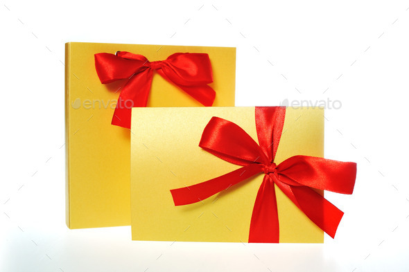 festive gold box with a red bow on a white background (Misc) Photo Download