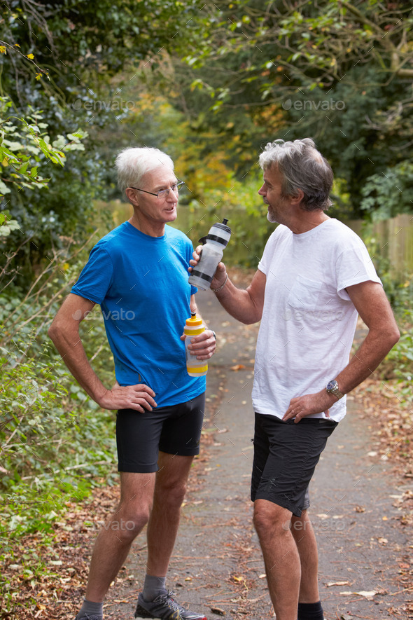 Two Mature Male Joggers Taking Break Whilst On Run