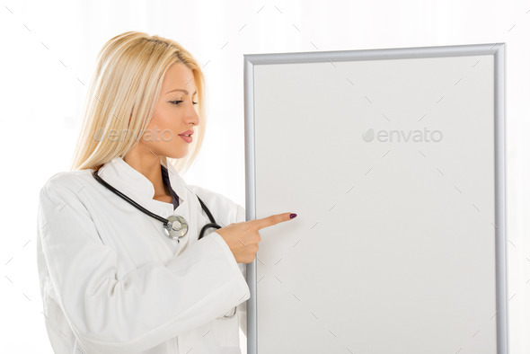 Female Doctor With Noticeboard