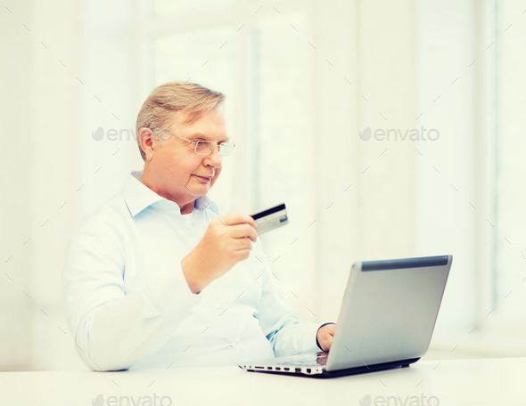 old man with laptop and credit card at home (Misc) Photo Download