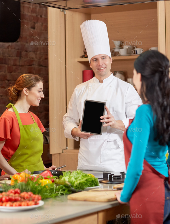 happy women with chef and tablet pc in kitchen