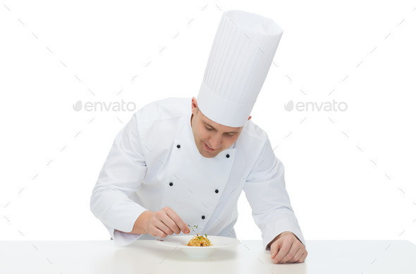happy male chef cook decorating dish
