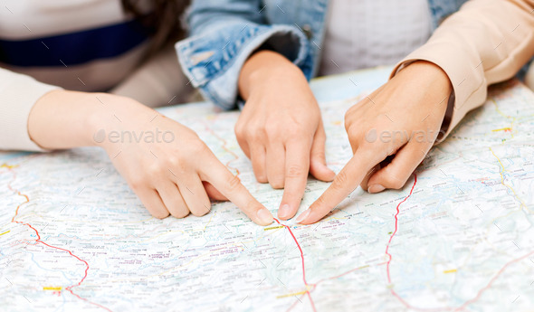 friends with tourist map in the city (Misc) Photo Download