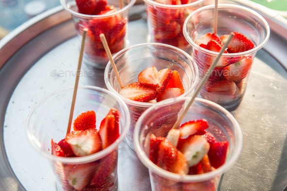 strawberry in plastic cups at street market (Misc) Photo Download