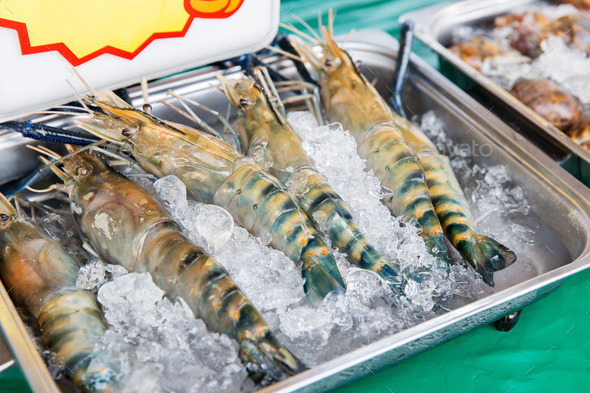 shrimps or seafood on ice at asian street market (Misc) Photo Download