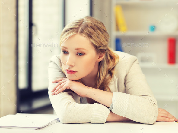 bored and tired woman behind the table (Misc) Photo Download