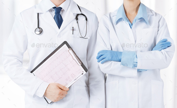 nurse and male doctor holding cardiogram (Misc) Photo Download