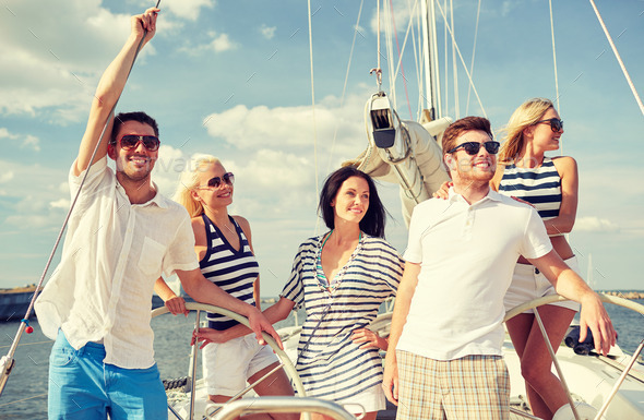 smiling friends sailing on yacht (Misc) Photo Download