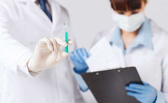 doctors with syringe (Misc) Photo Download