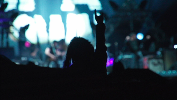 Girl Dancing Hands at Rock Concert Girl Dancing Hands at Rock Concert