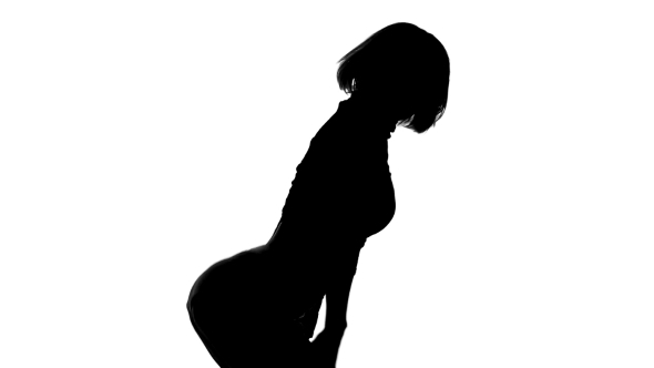 Silhouette Of Girl Dancing Energetically On a Silhouette Of Girl Dancing Energetically On a