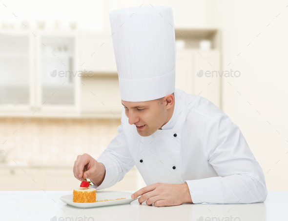 happy male chef cook decorating dessert