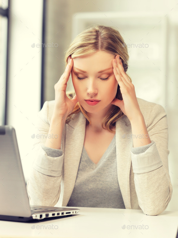 tired woman with laptop computer