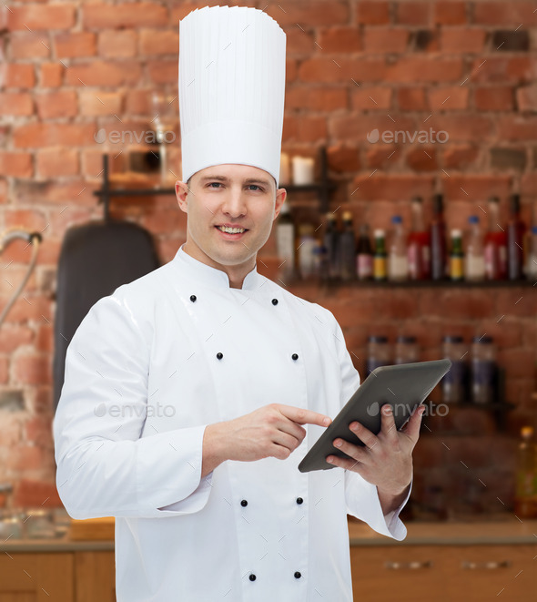 happy male chef cook holding tablet pc
