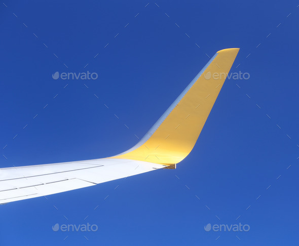 Wing of an airplane flying above sky (Misc) Photo Download