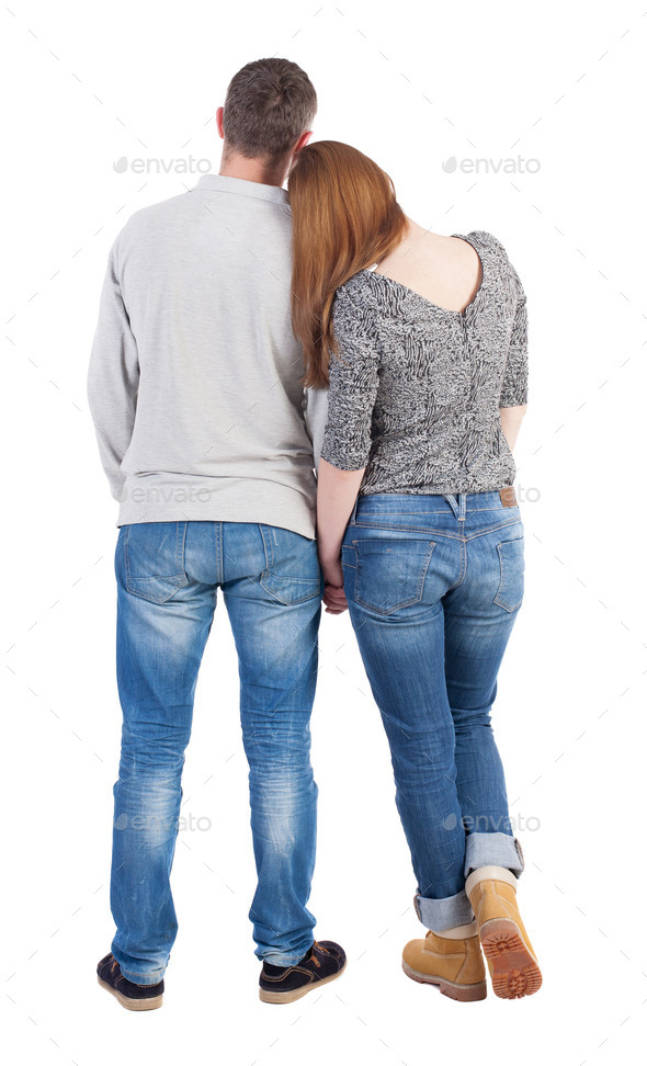 Back view of young embracing couple (man and woman) hug and look (Misc) Photo Download