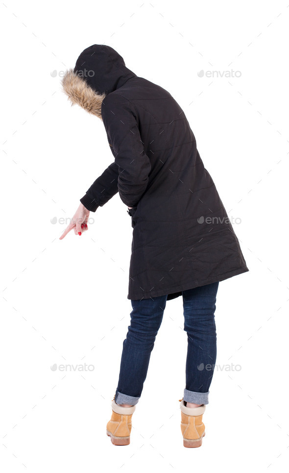 Back view of pointing young women in parka. (Misc) Photo Download