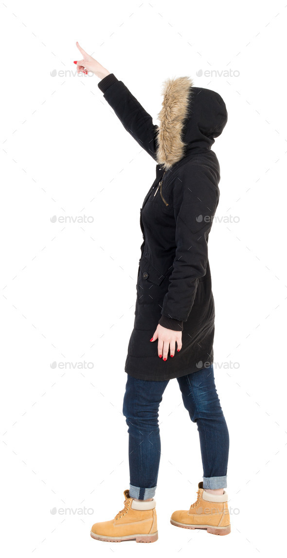 Back view of pointing young women in parka. (Misc) Photo Download