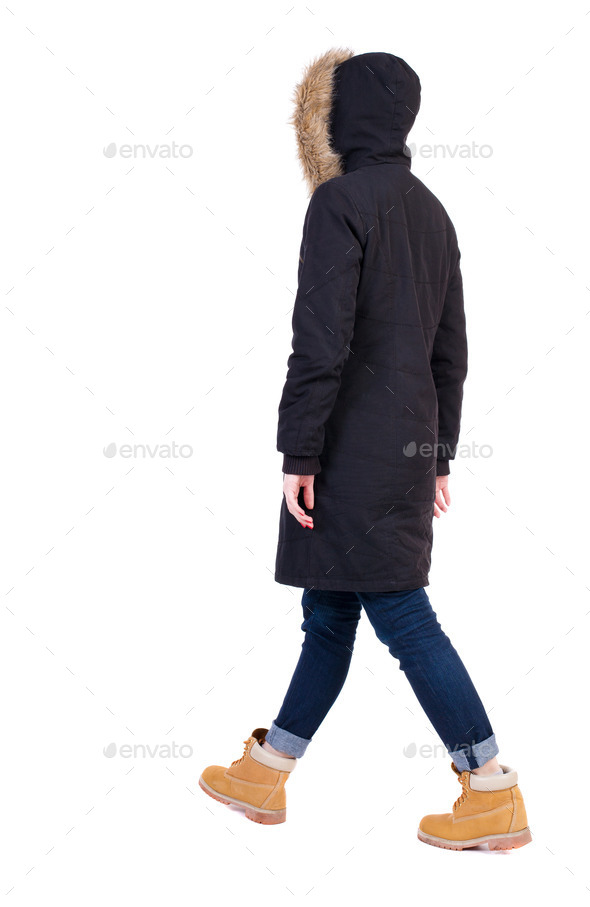 Back view of going woman in parka. (Misc) Photo Download