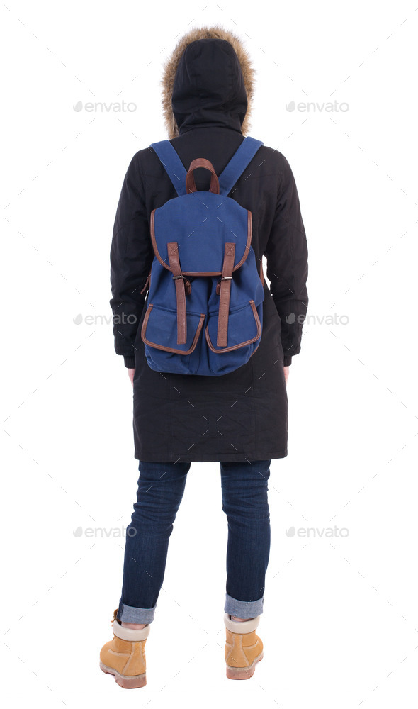 Back view woman in winter jacket with a backpack looking up (Misc) Photo Download