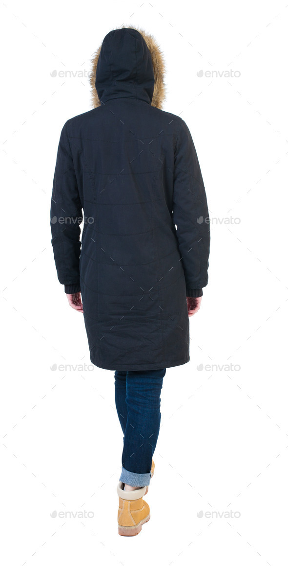 Back view of going woman in parka. (Misc) Photo Download