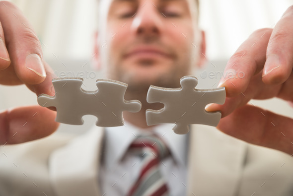 Businessman Connecting Together Puzzle (Misc) Photo Download