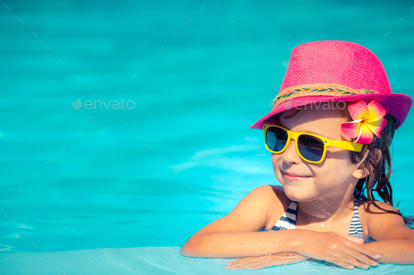 Child playing in swimming pool (Misc) Photo Download