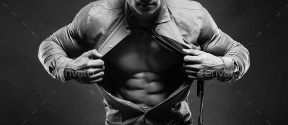 Young man displaying his abdominal muscles holding open his styl