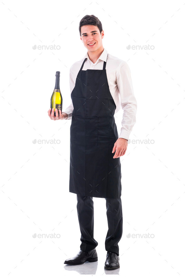 Young chef or waiter holding green champagne bottle