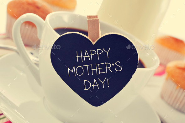 breakfast and happy mothers day written in a heart-shaped blackboard