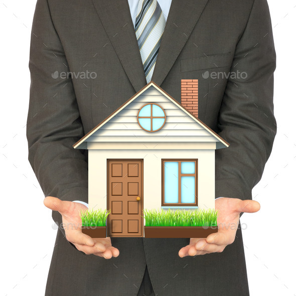 Man in suit holding house (Misc) Photo Download