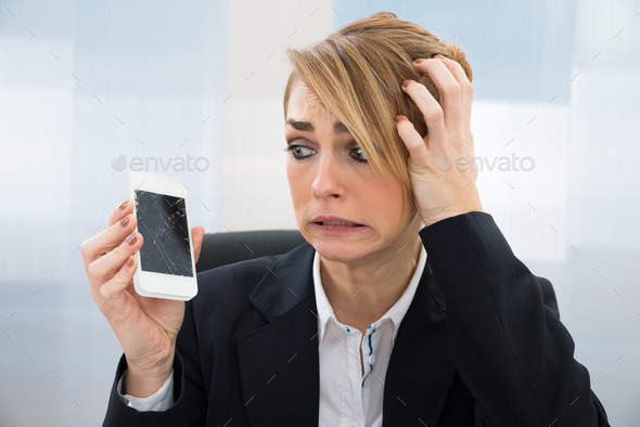 Businesswoman Holding Broken Smartphone