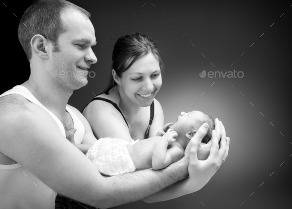 Newborn baby boy on the father's and mother's hand. (Misc) Photo Download