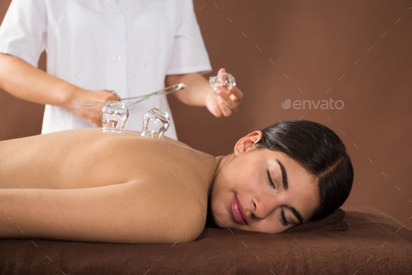 Young Woman Getting Cupping Treatment
