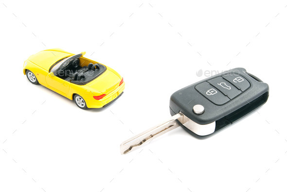 keys and yellow sport car on white (Misc) Photo Download