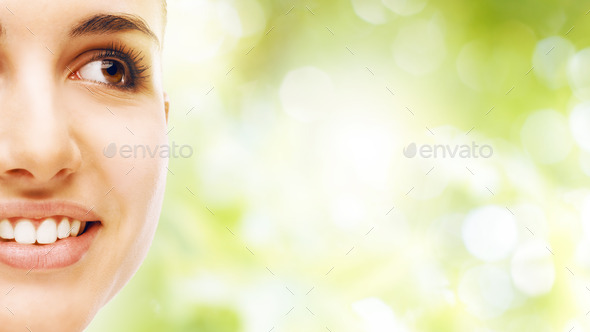 Young woman with glowing face skin