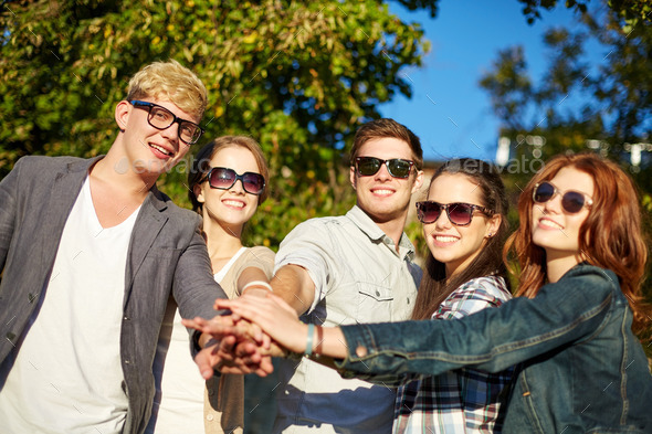 group of students or teenagers with hands on top (Misc) Photo Download