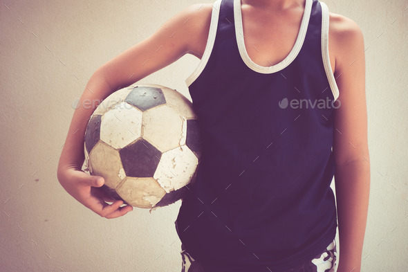 Children hold the old football with filter effect retro vintage style (Misc) Photo Download